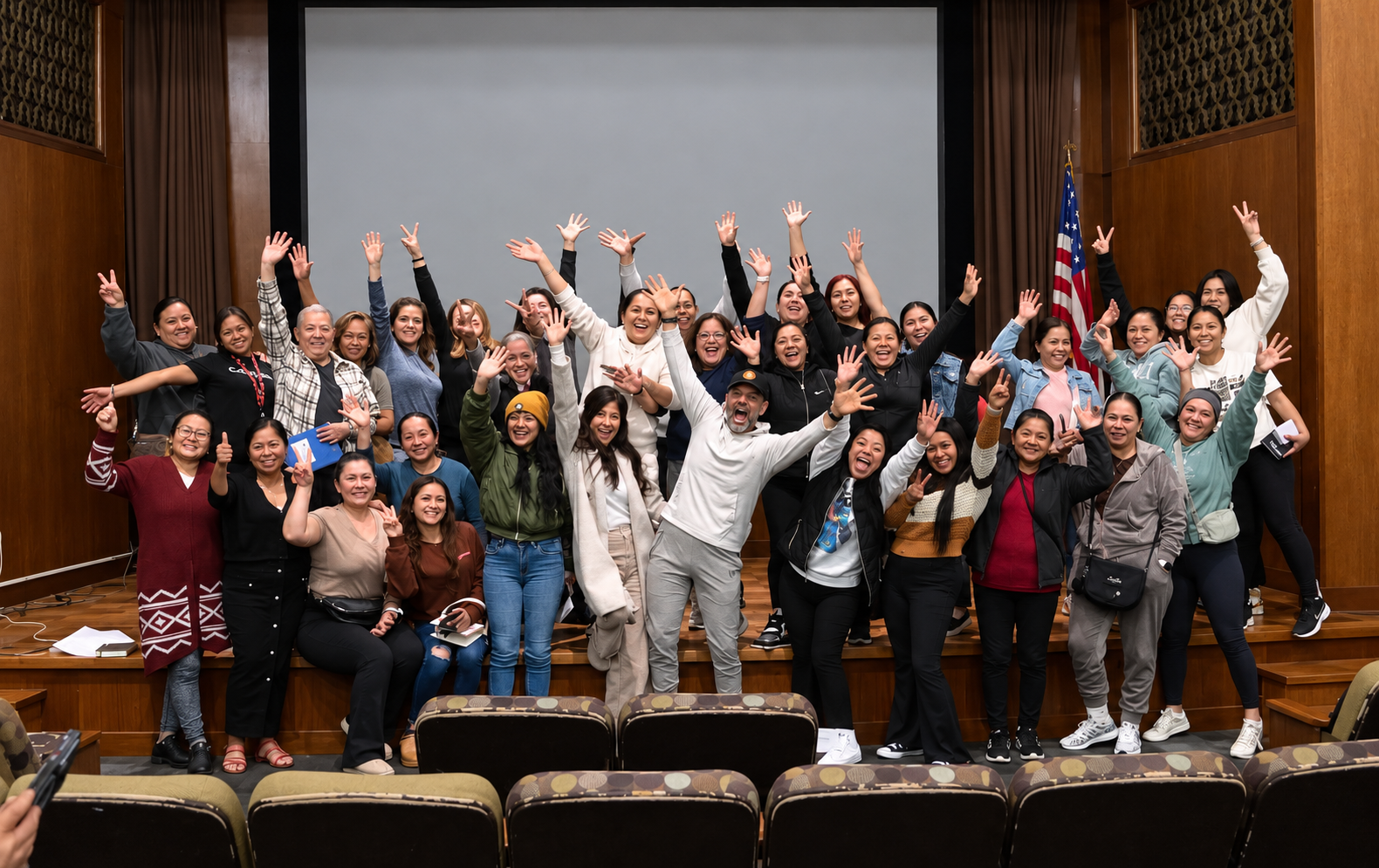 The Kleen family — cleaners and staff waving together at a company gathering